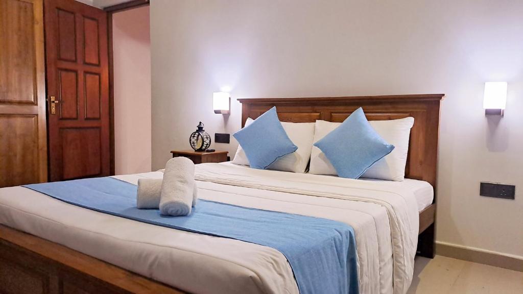 Postel nebo postele na pokoji v ubytování Golden Shower Inn