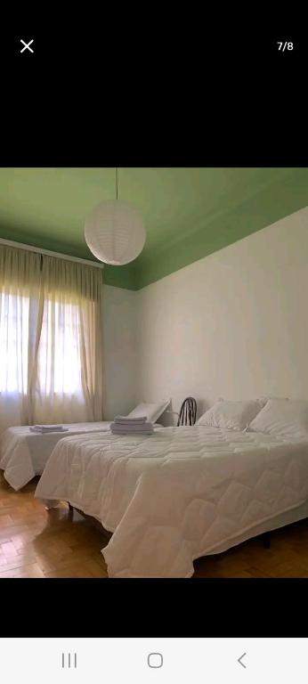 En eller flere senge i et værelse på CASA DA BIA