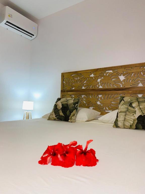 Postel nebo postele na pokoji v ubytování Fare Orahana Moorea