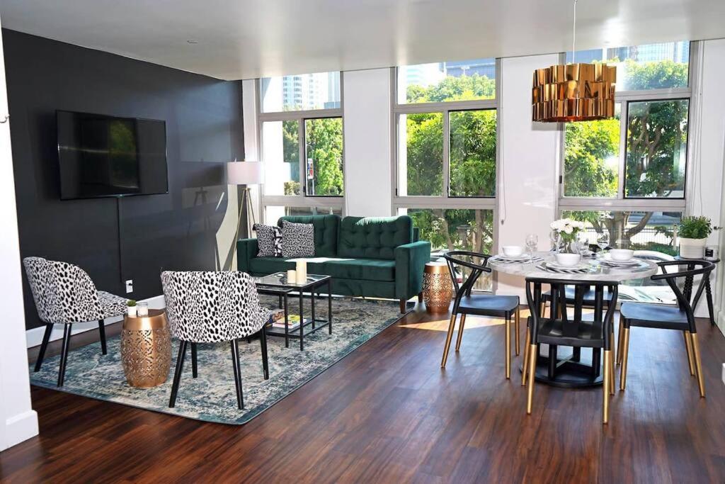 a living room with a dining table and chairs at Downtown LA- Free Parking - Style in the City in Los Angeles