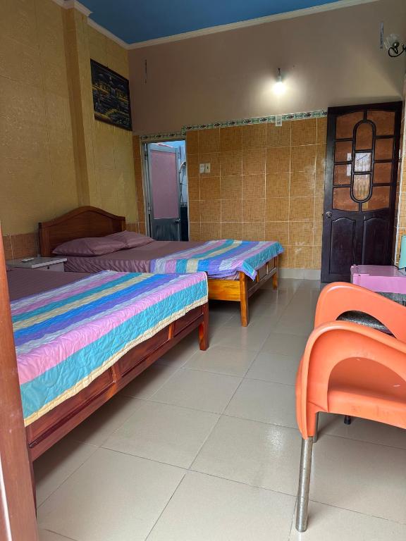 Postel nebo postele na pokoji v ubytování San Vuon Guesthouse