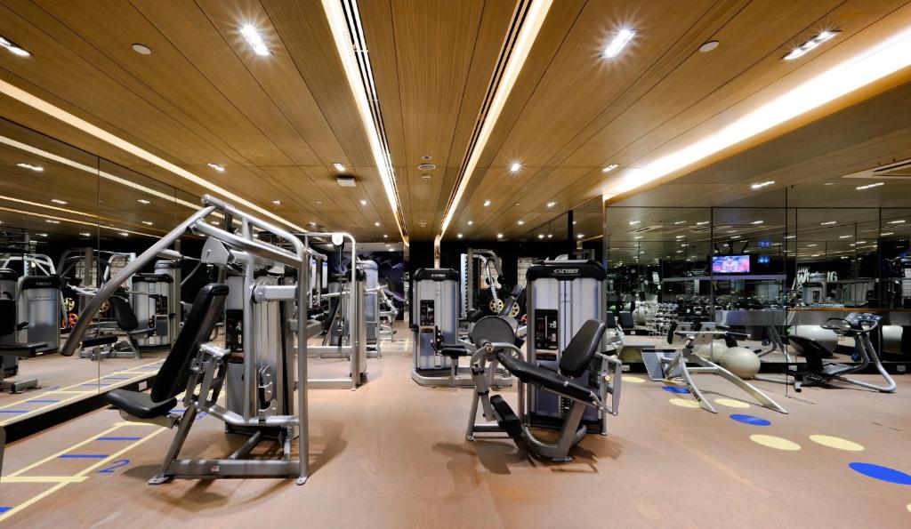 A full hotel gym with strength-training machines and cardio equipment.