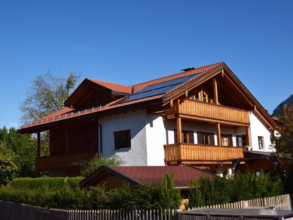 a large house with a wooden roof at Favorite place 2 in Garmisch-Partenkirchen