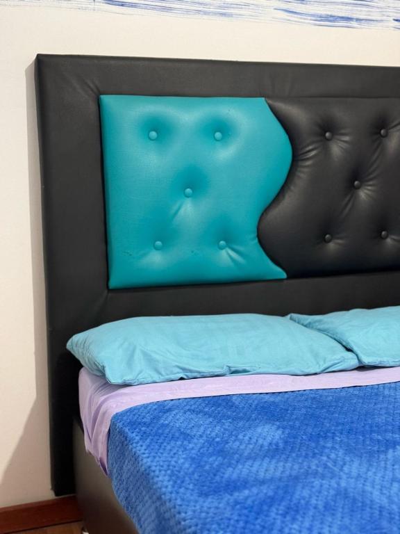 Postel nebo postele na pokoji v ubytování Hostel Bogotá Niza Tu sitio