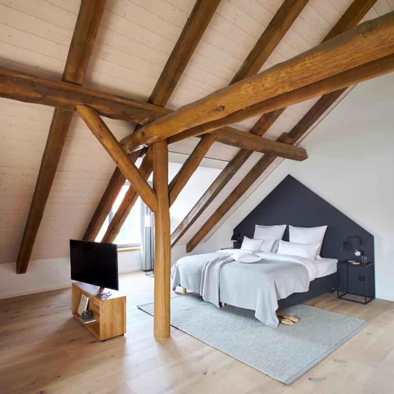 Postel nebo postele na pokoji v ubytování meinwolfsburg hotel auf dem rittergut vormals Yard Boarding Hotel