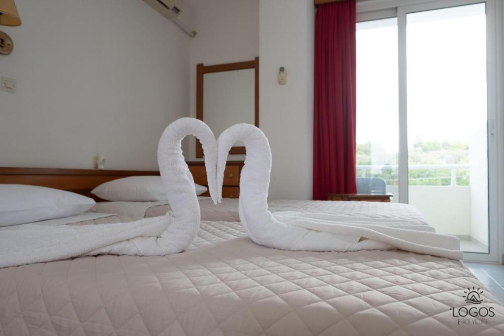 Postel nebo postele na pokoji v ubytování Let it Be Apartments