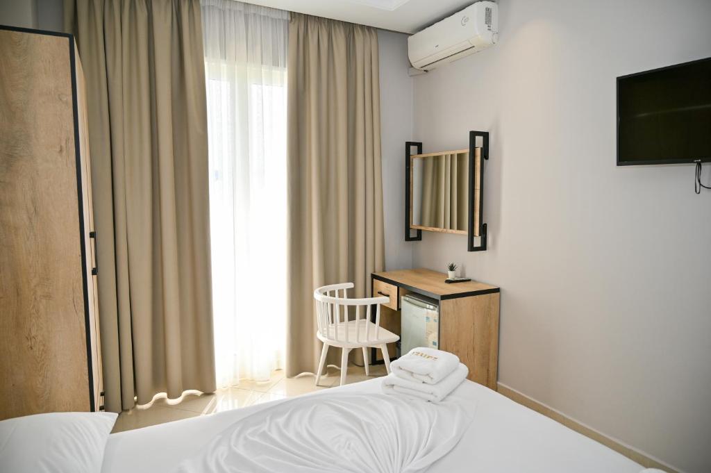 Uma cama ou camas num quarto em Hotel Zanzi