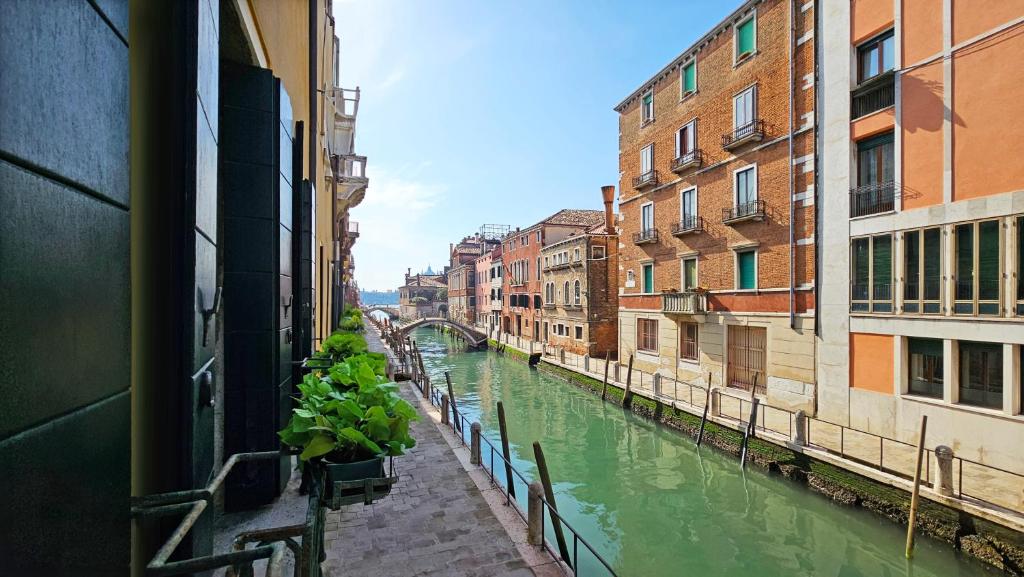 a view of a canal in a city with buildings at Ca' Messner 5 Leoni in Venice