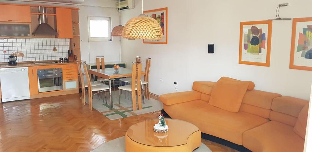 a living room with a couch and a table at Dimoski Apartment in Prilep