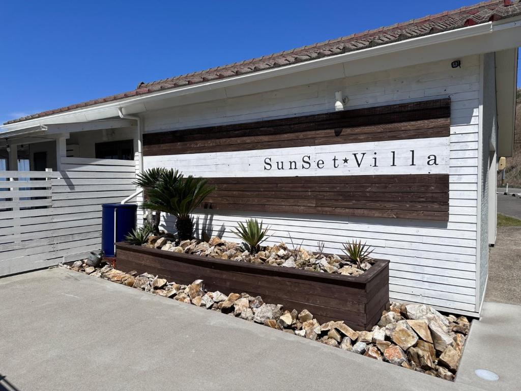 a building with a sign on the side of it at SunSet Villa - Vacation STAY 52994v in Nagaoka