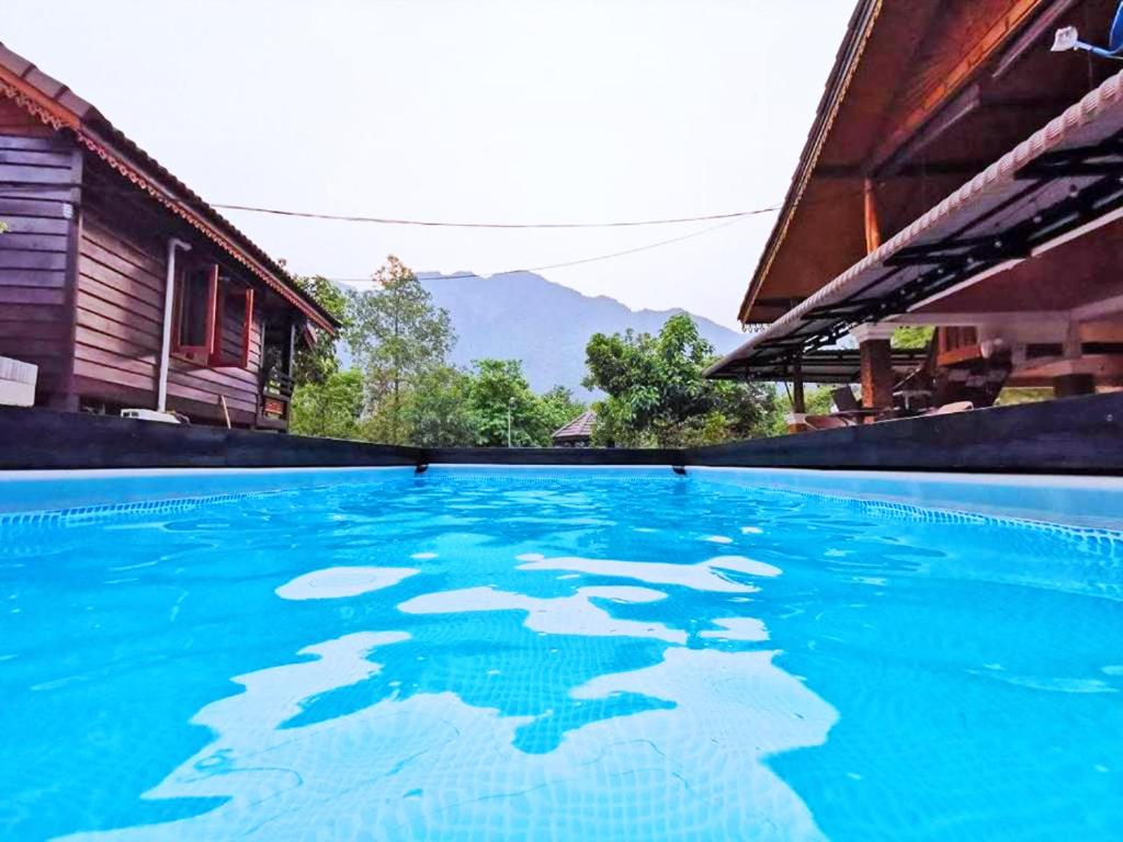 a swimming pool with ice on the water at Vang Vieng Garden Villa in Vang Vieng