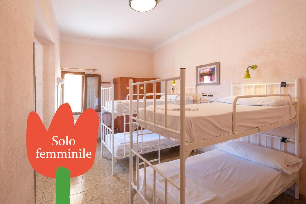 Postel nebo postele na pokoji v ubytování Hostel Archi Rossi
