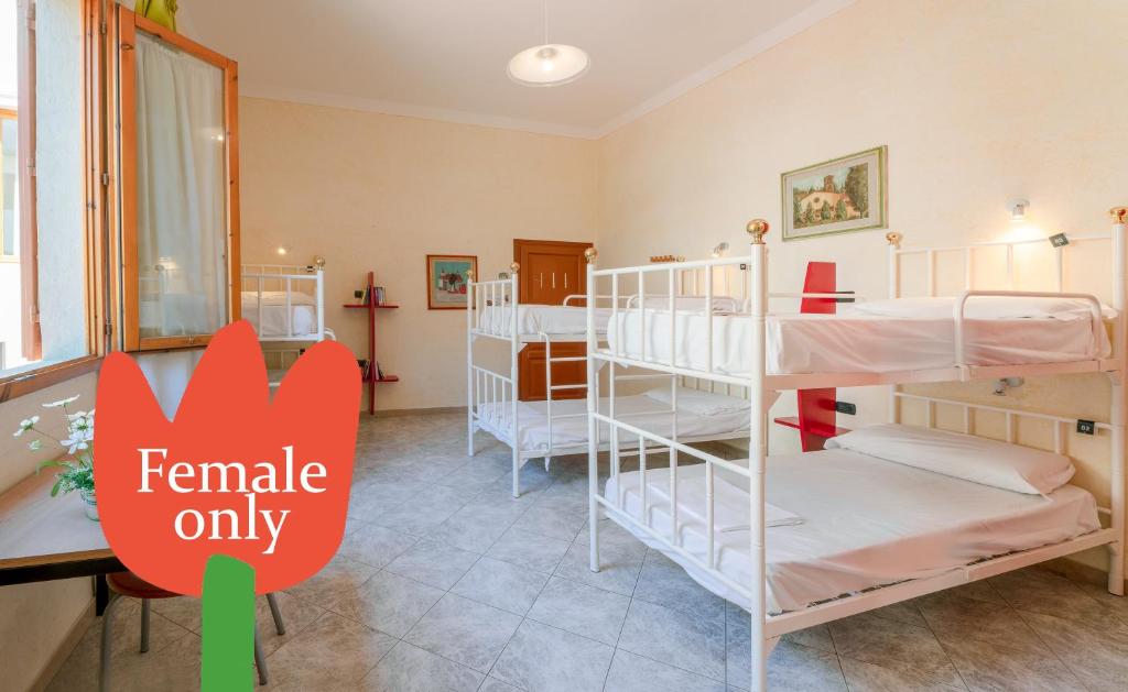 Postel nebo postele na pokoji v ubytování Hostel Archi Rossi