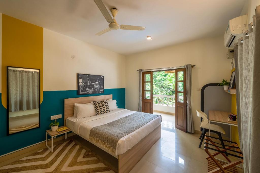 Postel nebo postele na pokoji v ubytování Olive Hotel Calangute Niwasa by Embassy Group