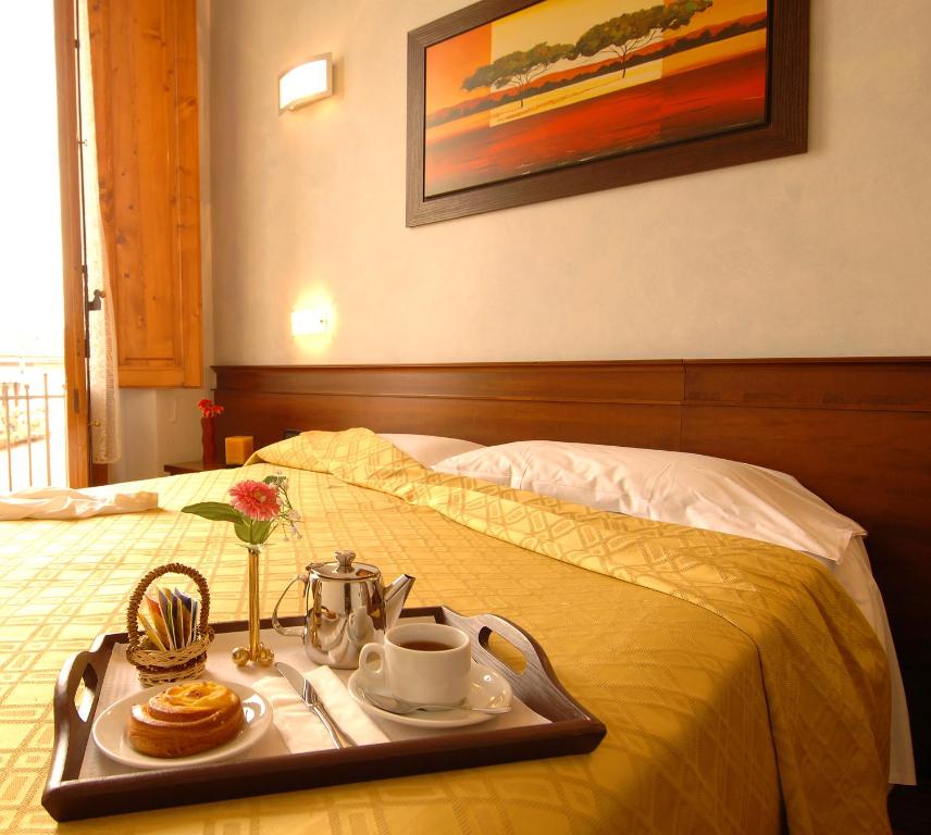 Postel nebo postele na pokoji v ubytování Hotel Palazzo Vecchio