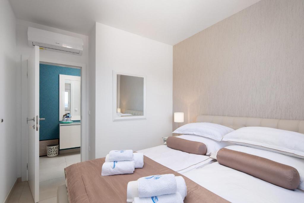 Posteľ alebo postele v izbe v ubytovaní A&D Deluxe Penthouse Apartment Dani