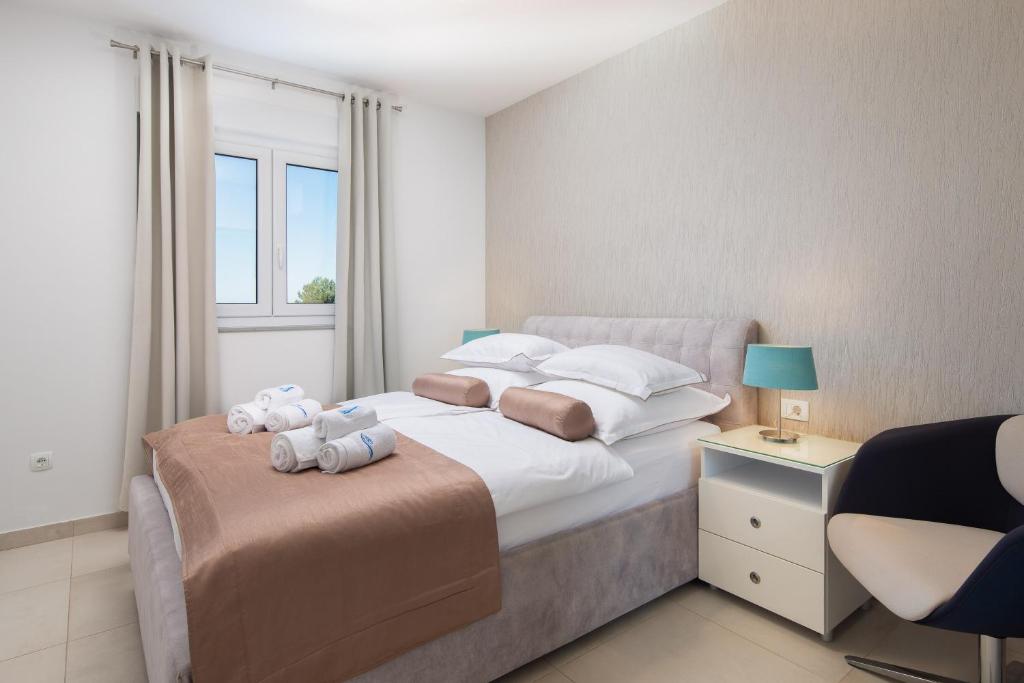 Posteľ alebo postele v izbe v ubytovaní A&D Deluxe Penthouse Apartment Dani