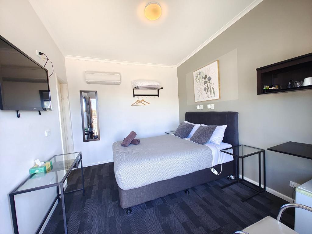 Postel nebo postele na pokoji v ubytování Altair Motel