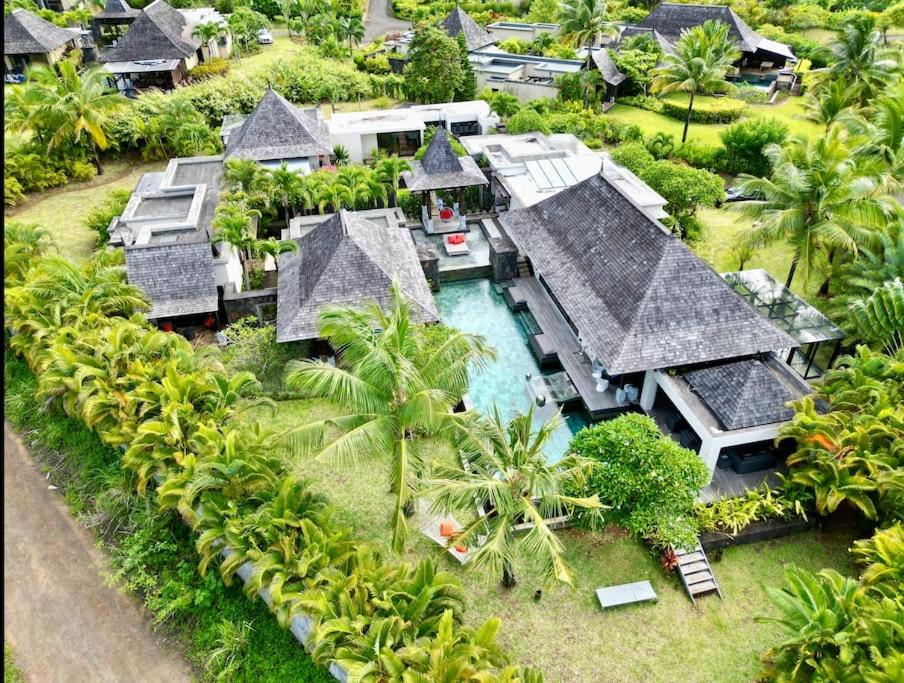 an aerial view of a house with a swimming pool at Villa Love in Bel Ombre