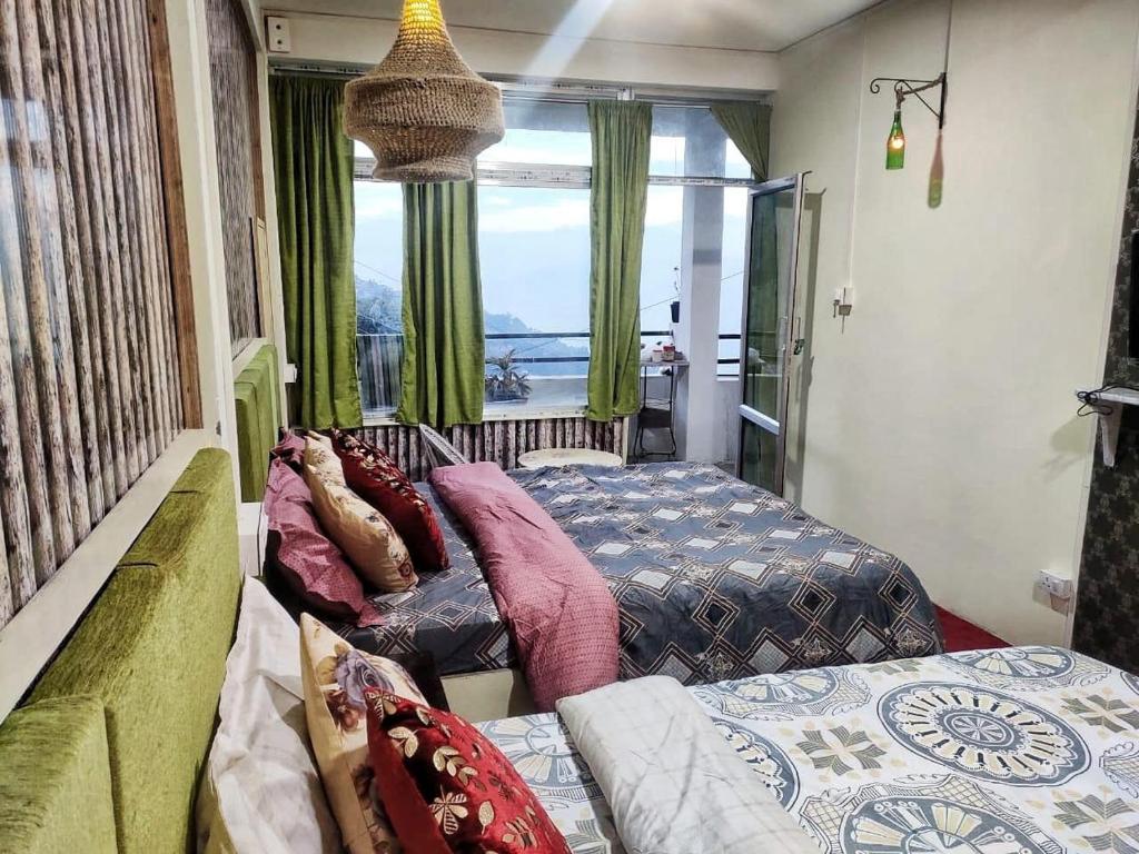 Postel nebo postele na pokoji v ubytování Jessica Homestay, Darjeeling