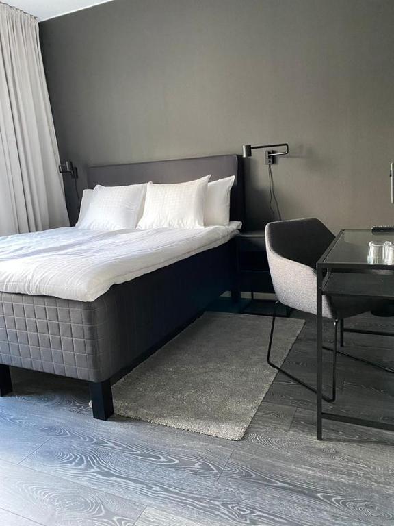 Postel nebo postele na pokoji v ubytování Hotell Iföhus