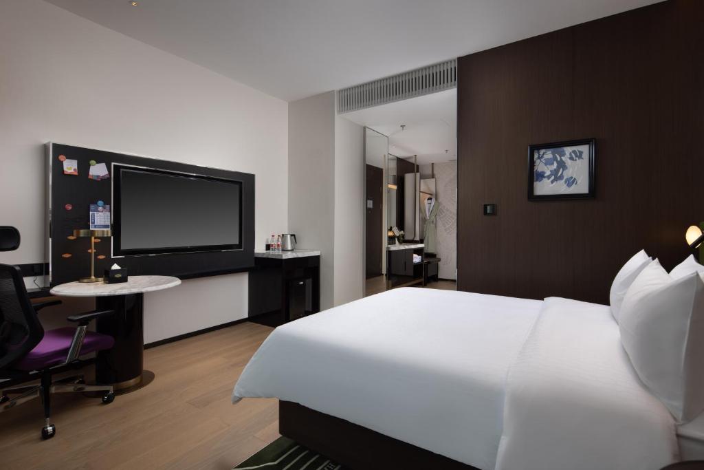 TV a/nebo společenská místnost v ubytování Hampton by Hilton Shenzhen Nanshan Science and Technology Park