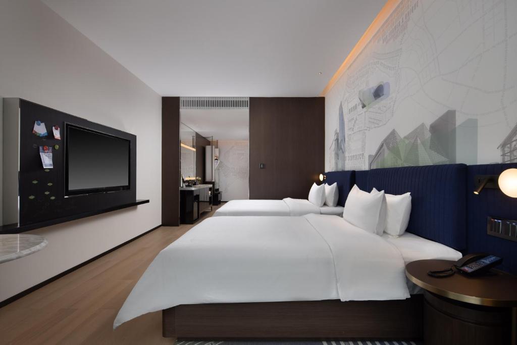TV a/nebo společenská místnost v ubytování Hampton by Hilton Shenzhen Nanshan Science and Technology Park