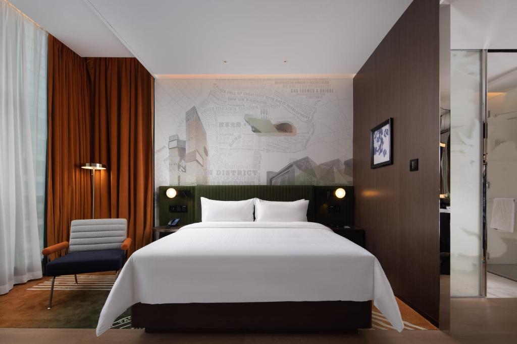 Postel nebo postele na pokoji v ubytování Hampton by Hilton Shenzhen Nanshan Science and Technology Park