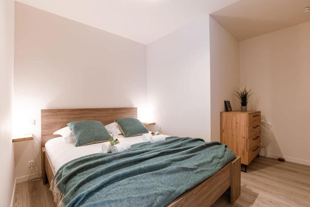 Postel nebo postele na pokoji v ubytování Huswell - Bright apartment only 5 minutes from the beach