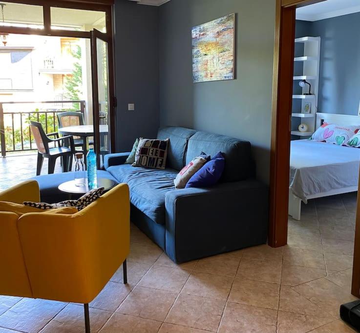 a living room with a couch and a bed at Santa Marina, Lovely 1-bedroom apartment in Sozopol