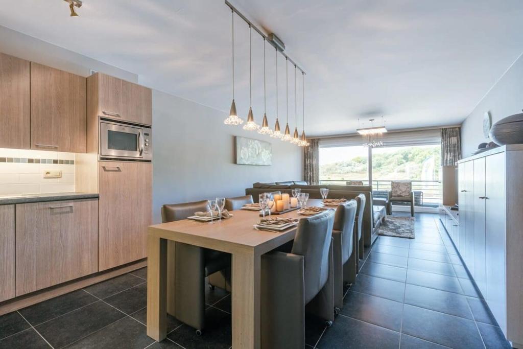 Kuchyň nebo kuchyňský kout v ubytování Huswell - Bright apartment with parking near the beach