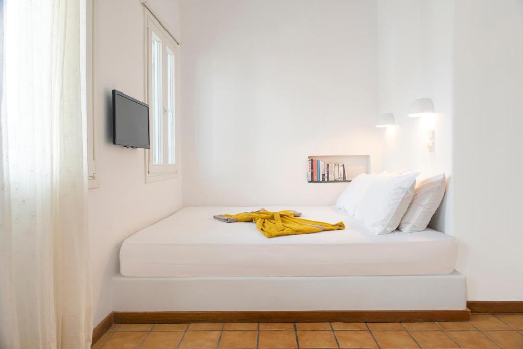 Кровать или кровати в номере Archipelago Sifnos - Seaside Accommodation
