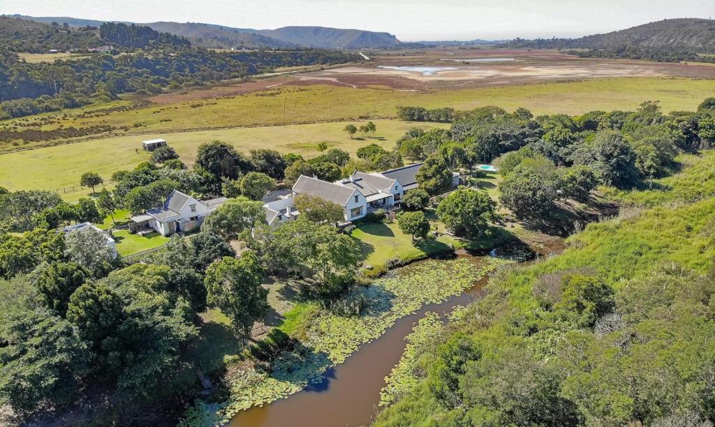 an aerial view of a house with a river at Bitou River Lodge in Plettenberg Bay