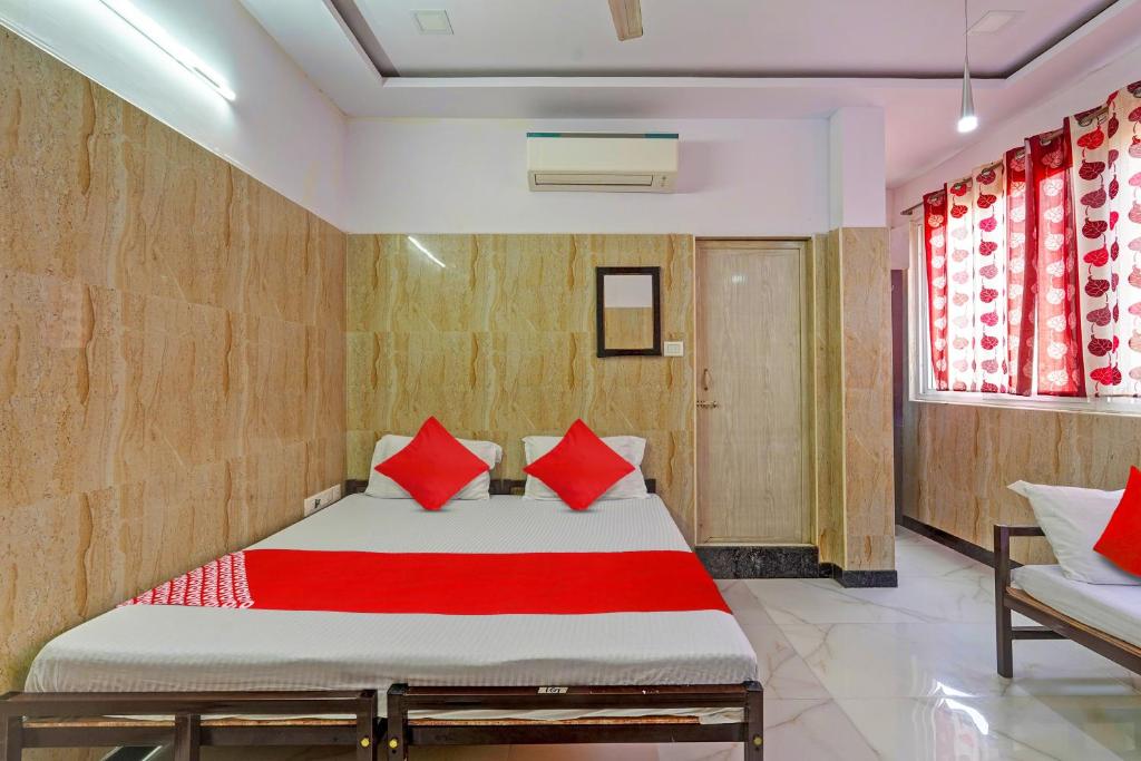 Ліжко або ліжка в номері Super OYO RKH Residency