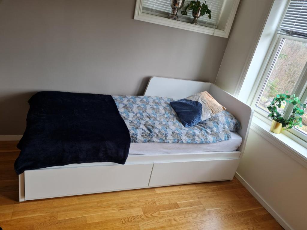 Postel nebo postele na pokoji v ubytování Kaldvell Apartman