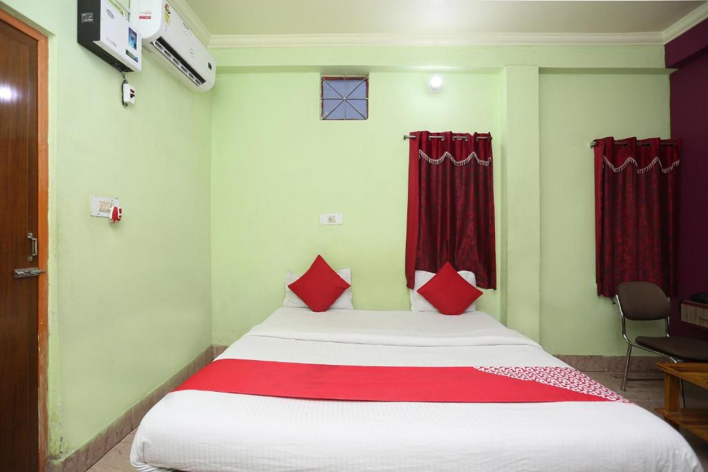 Postel nebo postele na pokoji v ubytování Hotel O Ma Guest House