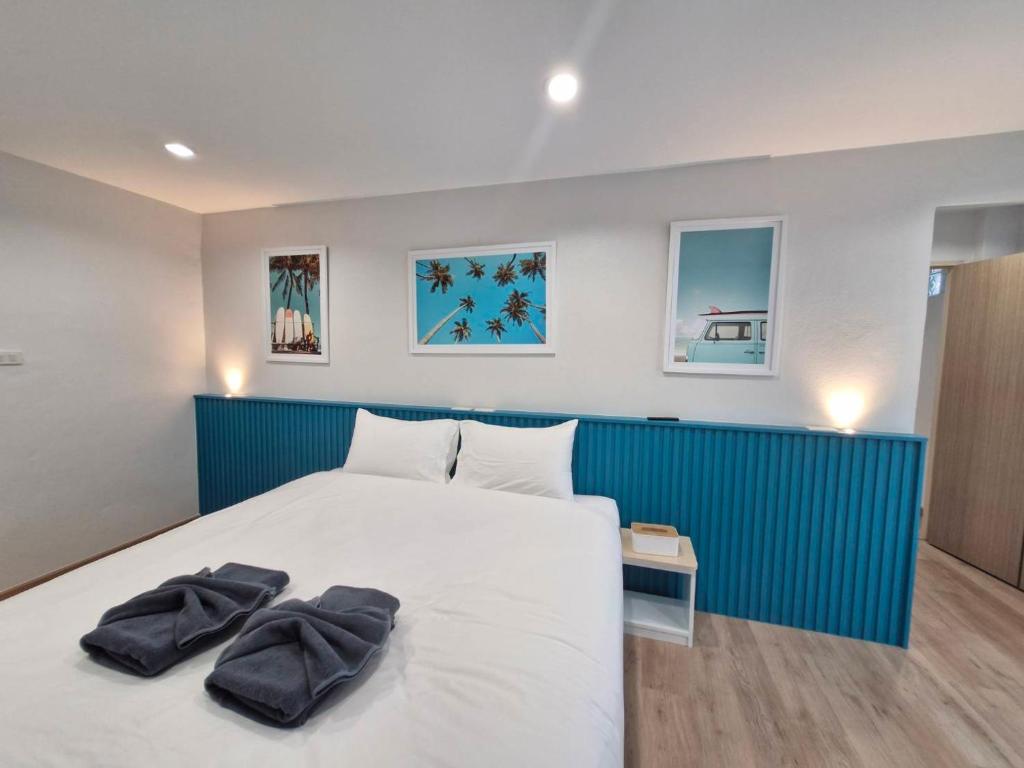 Postel nebo postele na pokoji v ubytování Otter House Aonang Soi 13