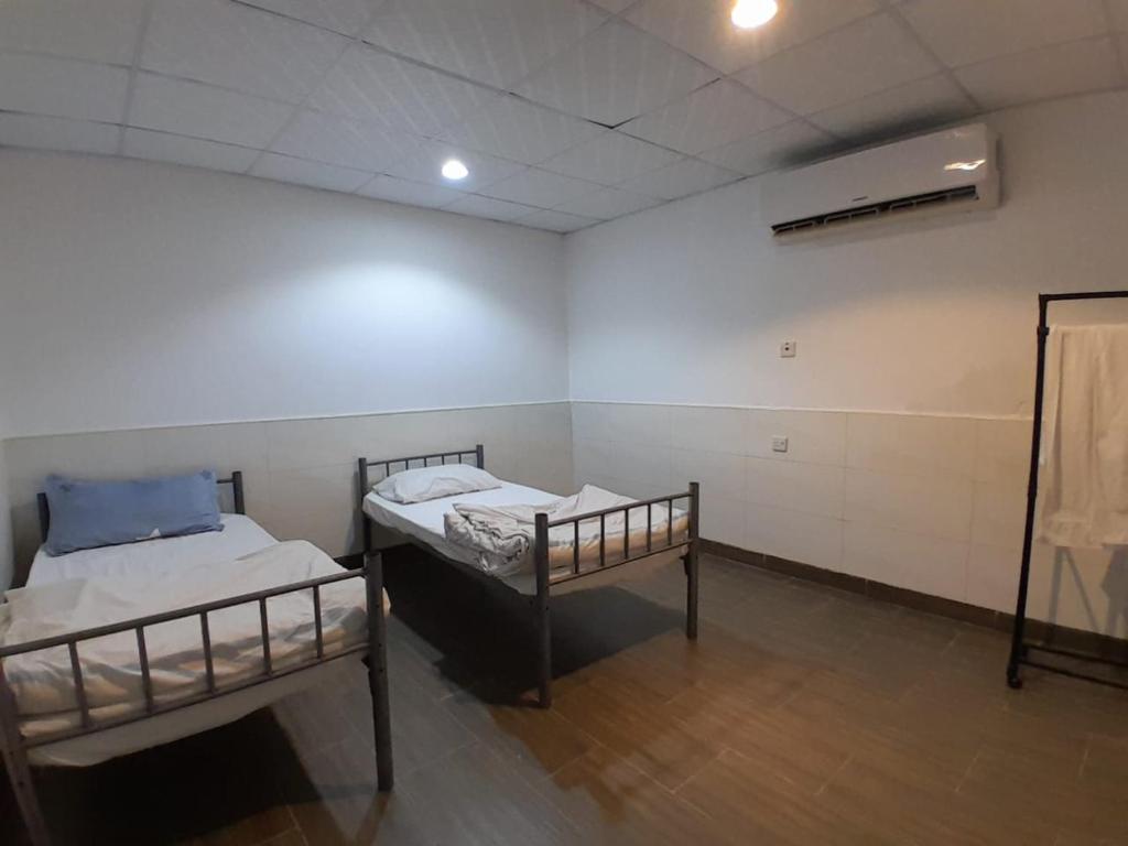 Postel nebo postele na pokoji v ubytování EK Homes