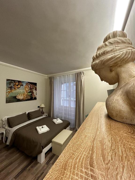 Postel nebo postele na pokoji v ubytování Le Colonne Di San Luca Affittacamere