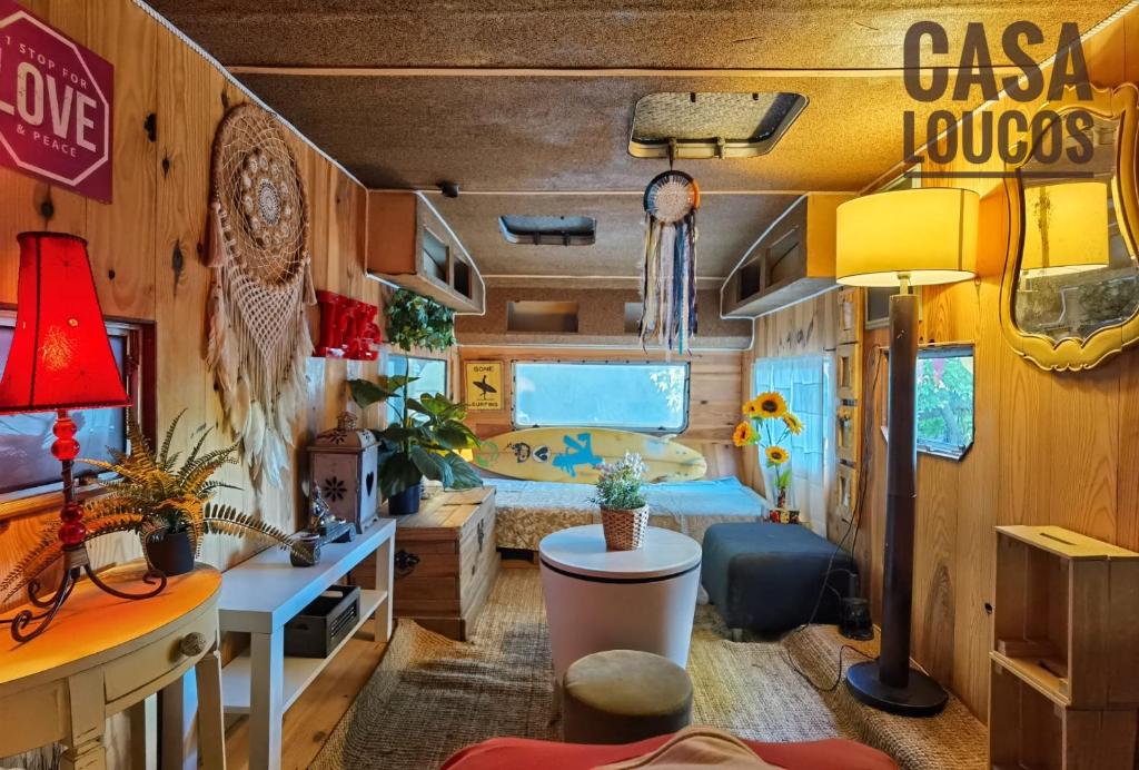 a room with a caravan with a bed and a desk at Caravan of Love by Casa das Artes in Luz de Tavira