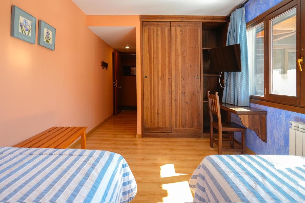 Postel nebo postele na pokoji v ubytování HOTEL TURPÍ
