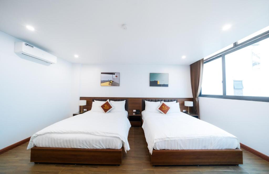 Postel nebo postele na pokoji v ubytování Lam Anh Hotel 6 Ngoại Giao Đoàn BT4-10