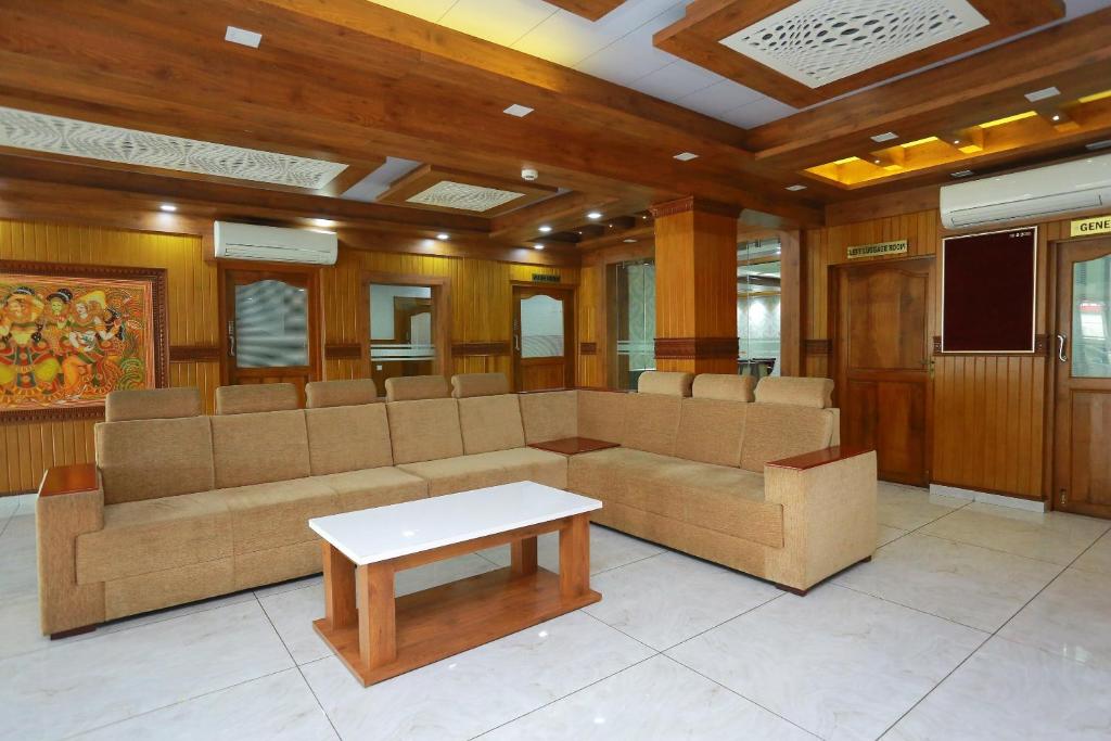 a conference room with chairs and a table at Kovilakam Residency in Trichūr
