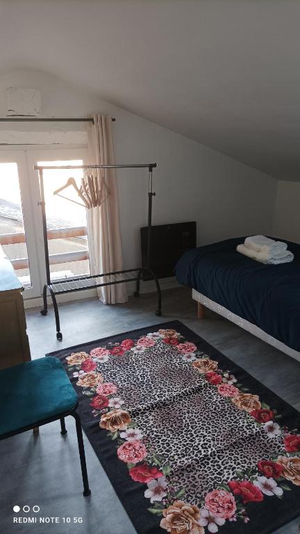 Postel nebo postele na pokoji v ubytování DÉDÉ DU VAL B&B