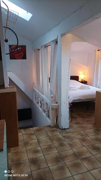 Postel nebo postele na pokoji v ubytování DÉDÉ DU VAL B&B