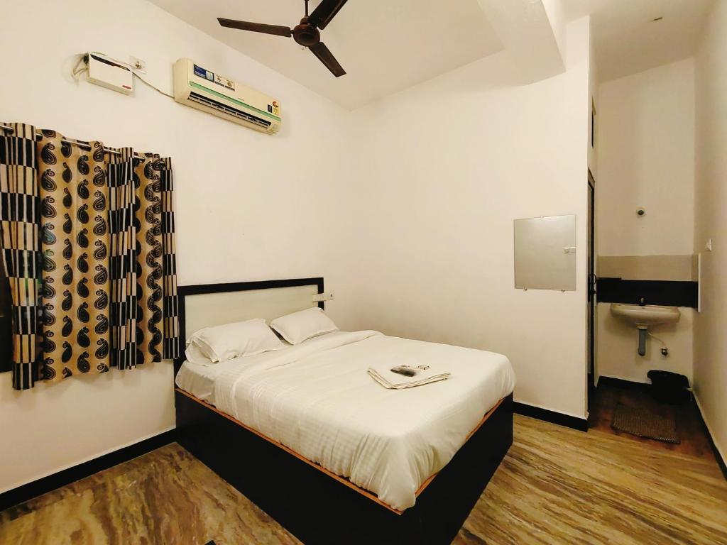 Postel nebo postele na pokoji v ubytování Le Dreamy Residency