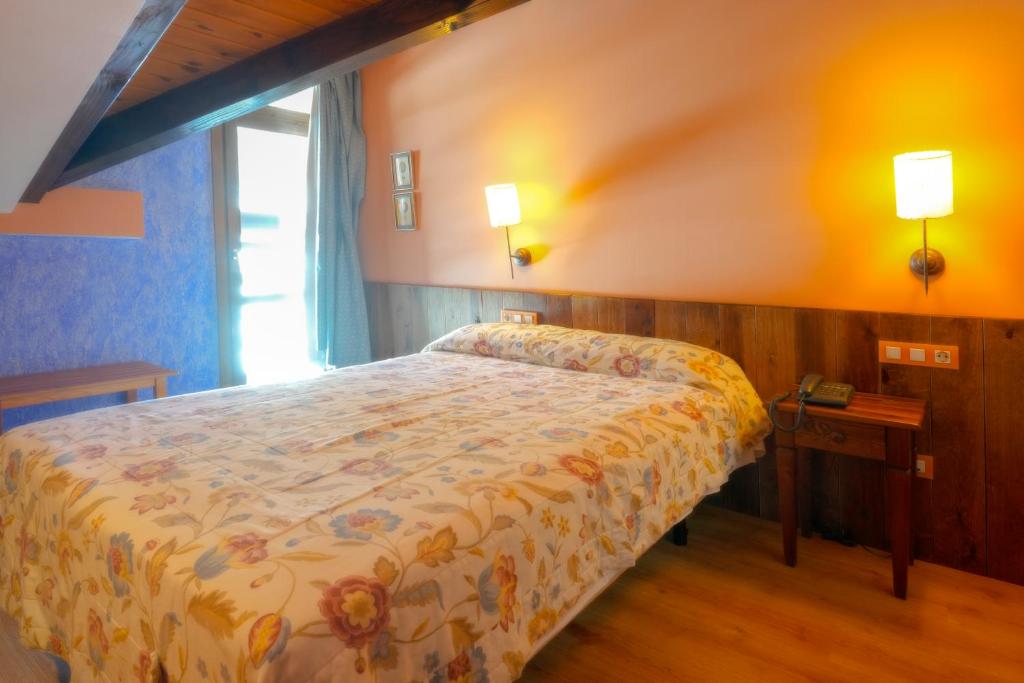 Postel nebo postele na pokoji v ubytování HOTEL TURPÍ