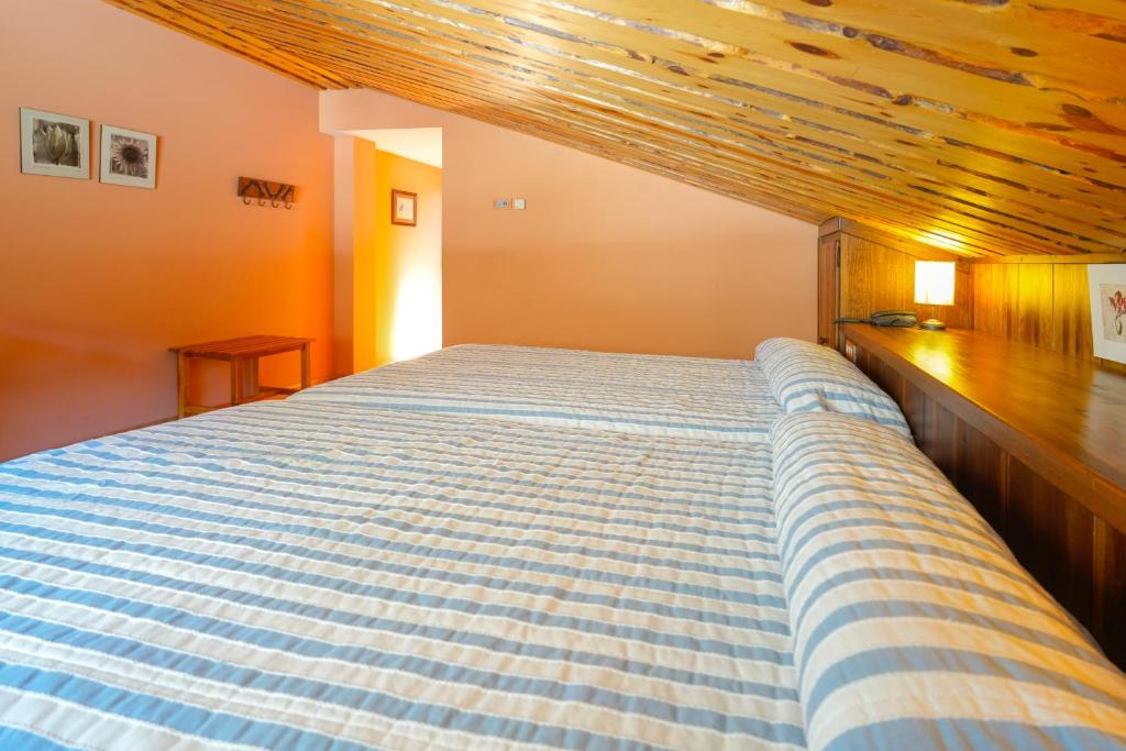 Postel nebo postele na pokoji v ubytování HOTEL TURPÍ