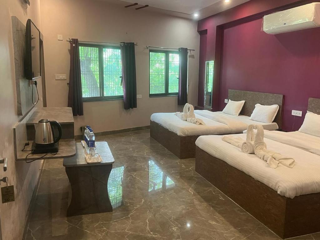 TV a/nebo společenská místnost v ubytování Kashi Inn