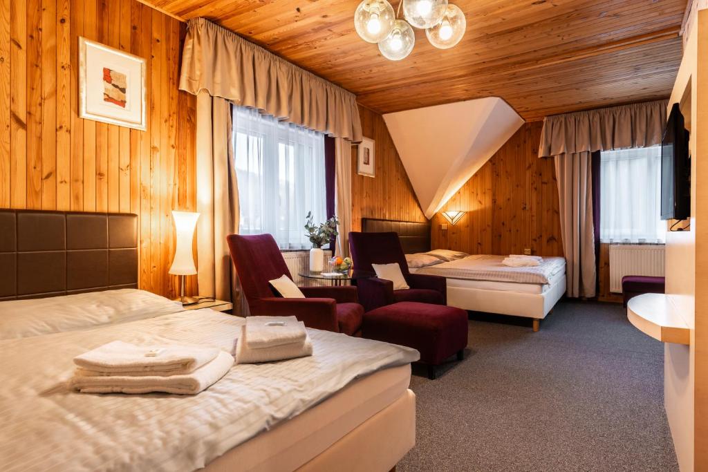 Postel nebo postele na pokoji v ubytování Hotel Schwarz
